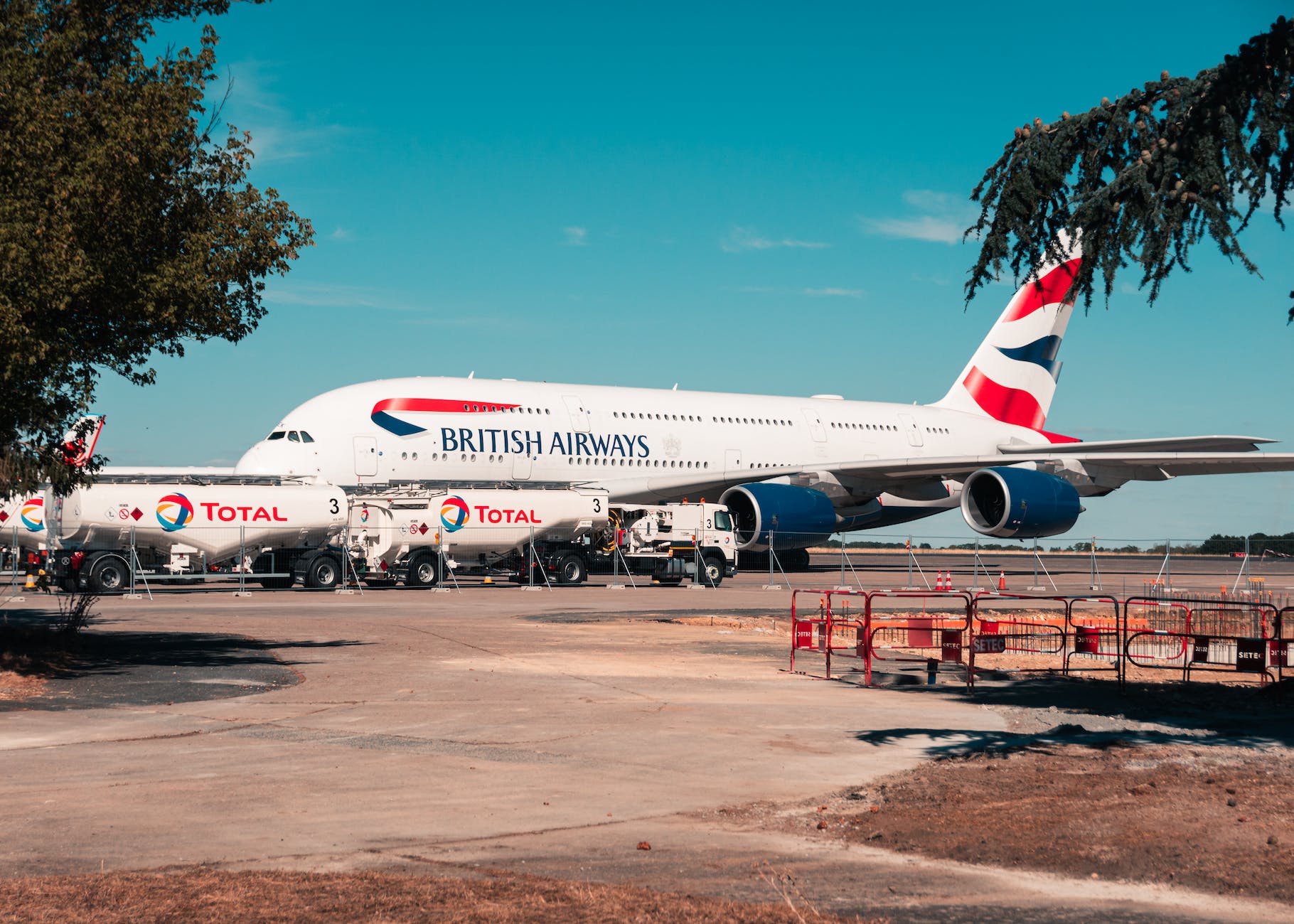 a white grounded aircraft