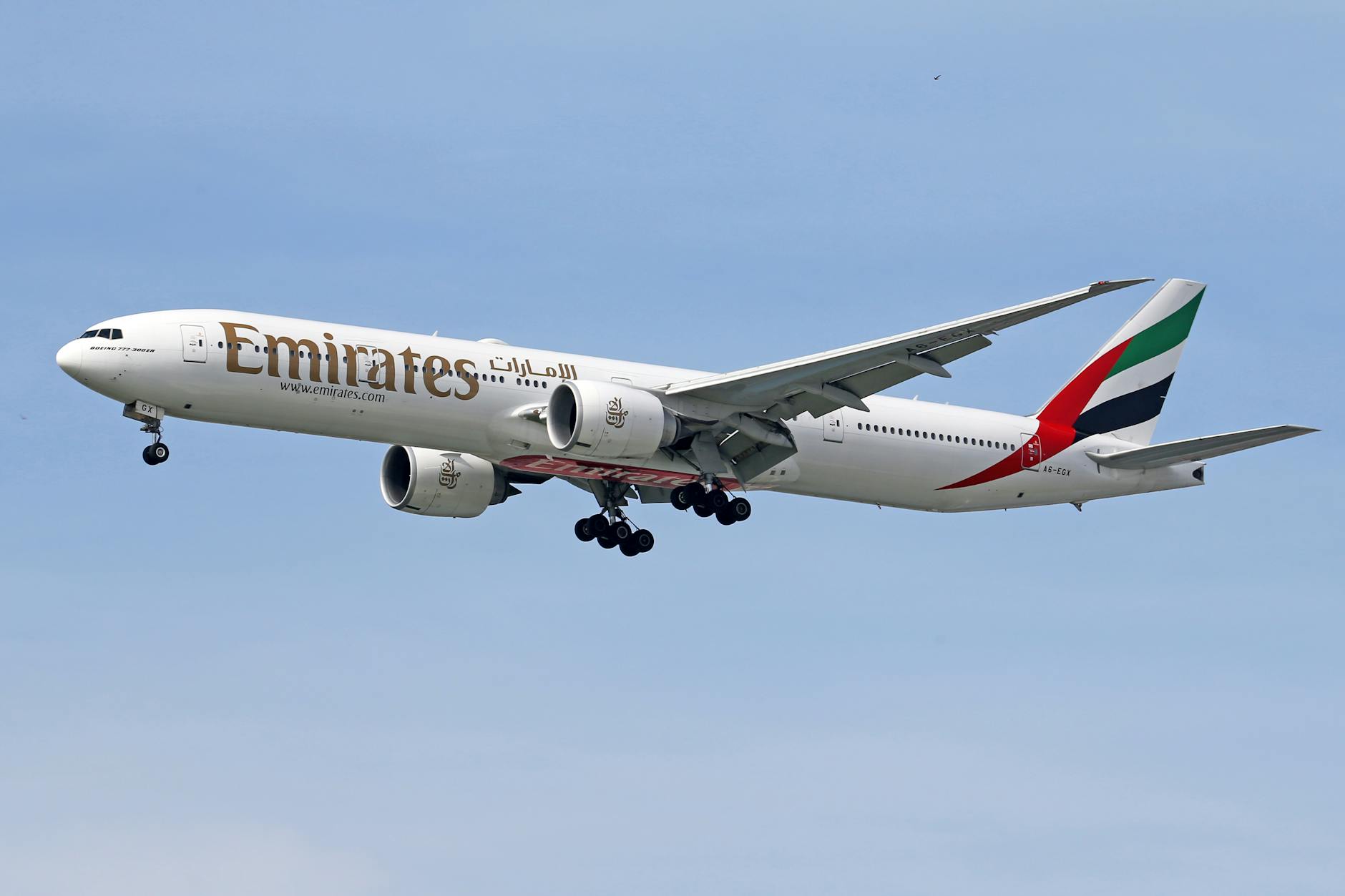 white and red passenger plane in the sky