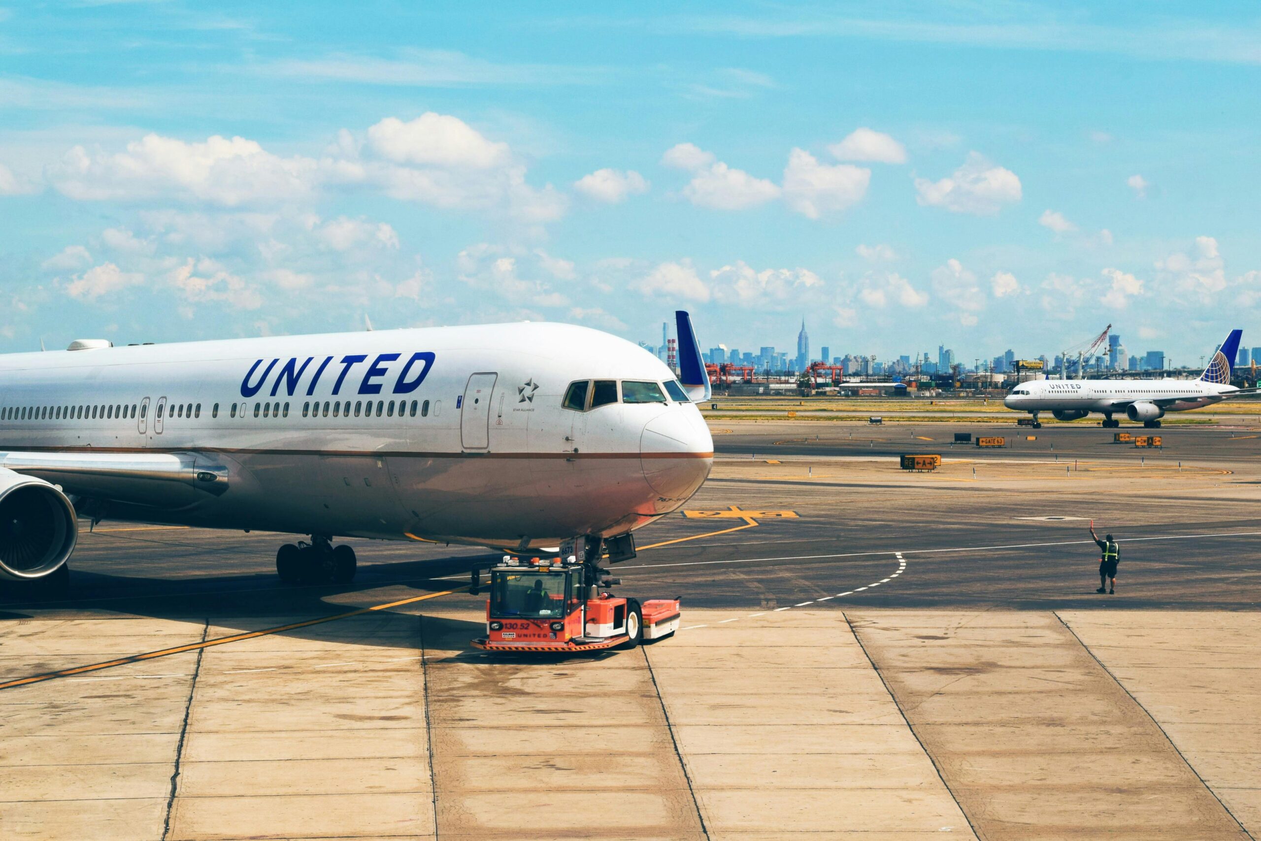 Photo by Tim Gouw: https://www.pexels.com/photo/white-airplane-near-man-in-green-vest-175656/